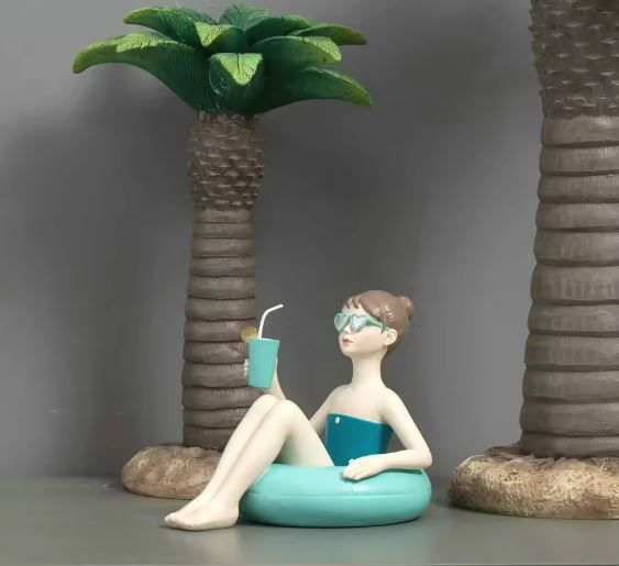 Mädchen im Schwimmring grün